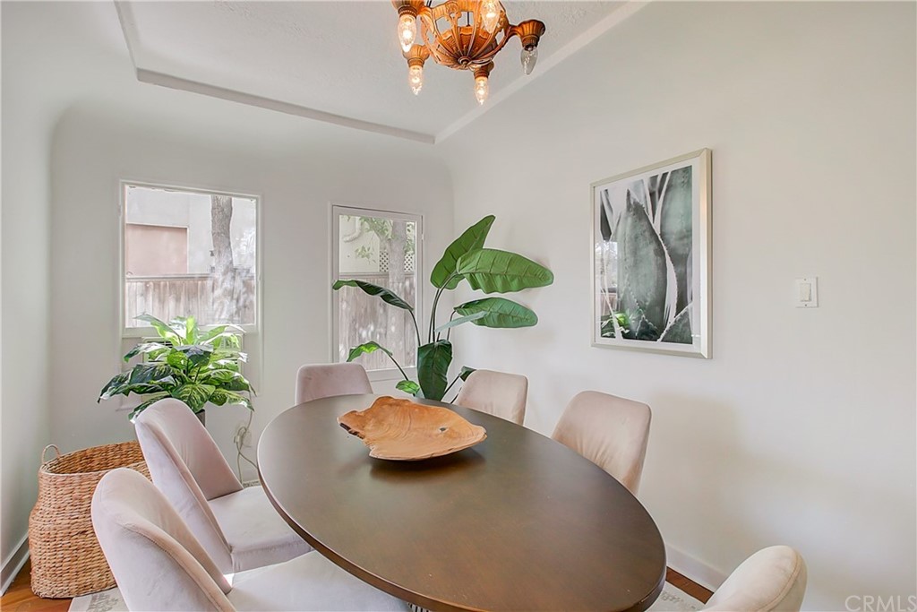 1126 Scofield Drive Glendale, CA 91205 - Photo 12 of 49 a view of a dining room with furniture a rug and wooden floor