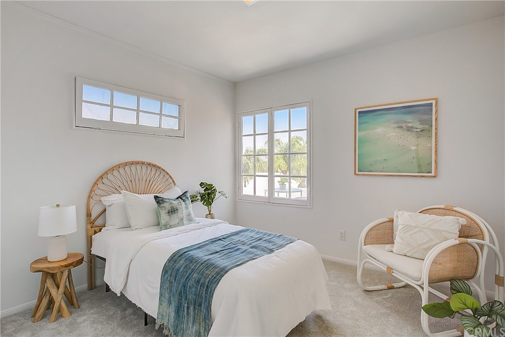 1126 Scofield Drive Glendale, CA 91205 - Photo 19 of 49 a bedroom with a bed and a chair