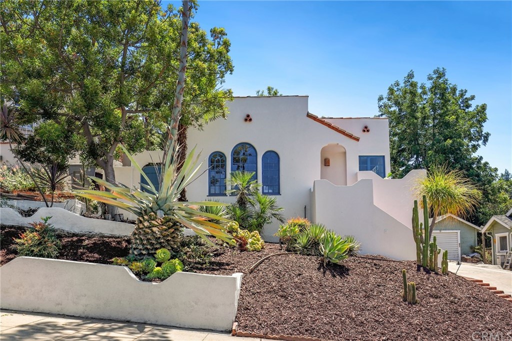 1126 Scofield Drive Glendale, CA 91205 - Photo 2 of 49 a front view of a house with garden