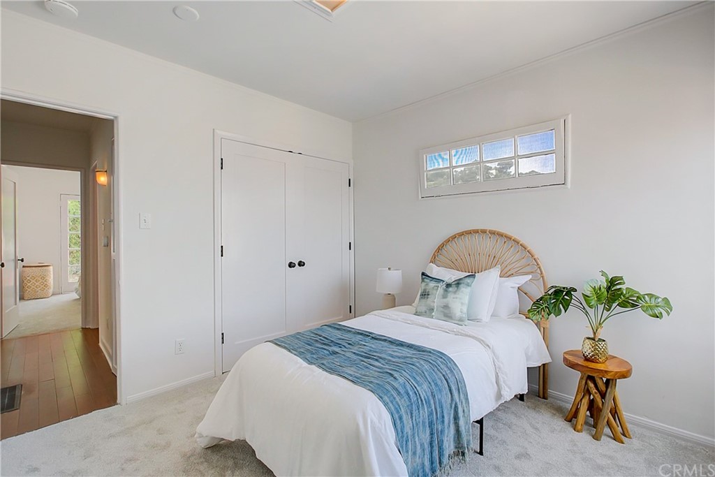 1126 Scofield Drive Glendale, CA 91205 - Photo 21 of 49 a bedroom with a bed and a potted plant