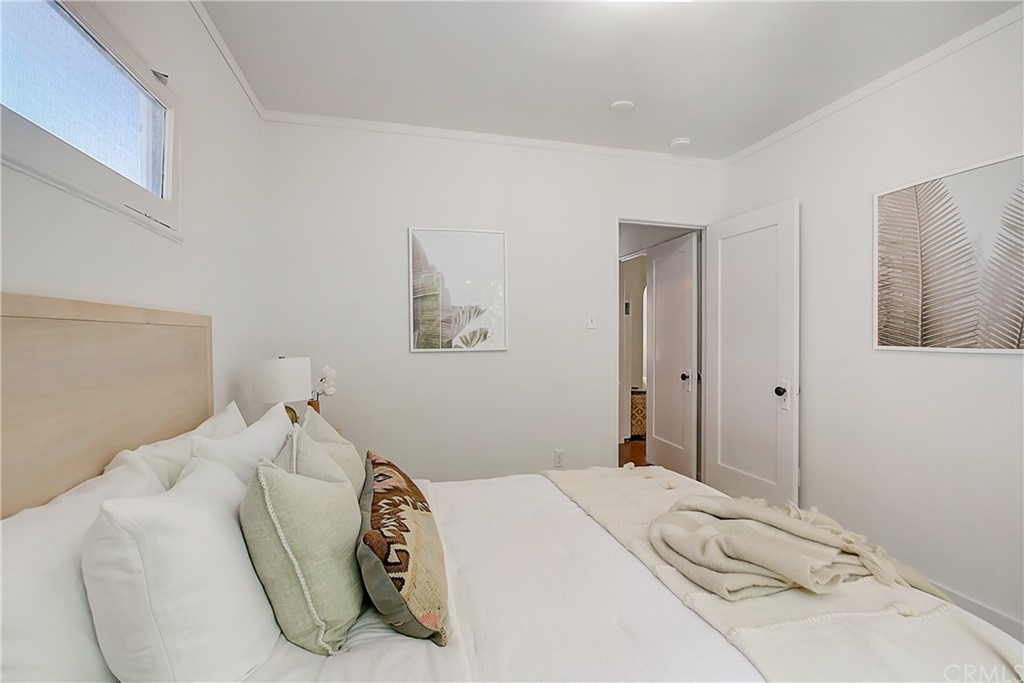1126 Scofield Drive Glendale, CA 91205 - Photo 24 of 49 a bedroom with a bed and a painting on the wall