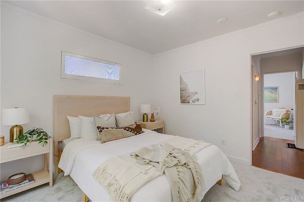 1126 Scofield Drive Glendale, CA 91205 - Photo 25 of 49 a bedroom with a bed and painting on the wall