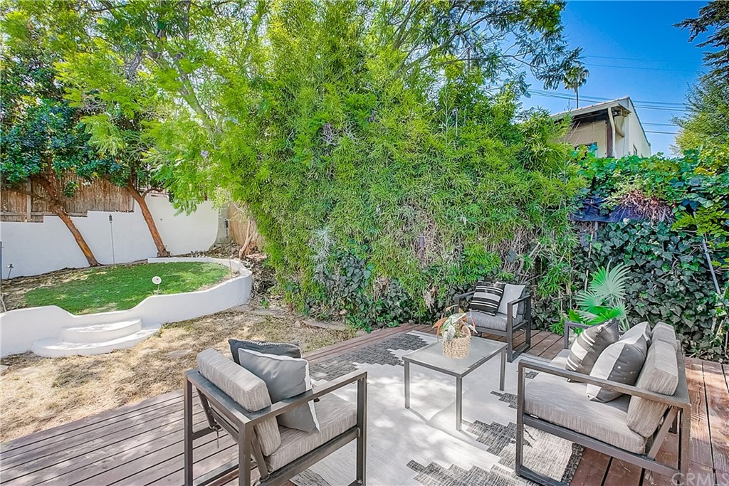 1126 Scofield Drive Glendale, CA 91205 - Photo 26 of 49 a view of a patio with table and chairs and potted plants