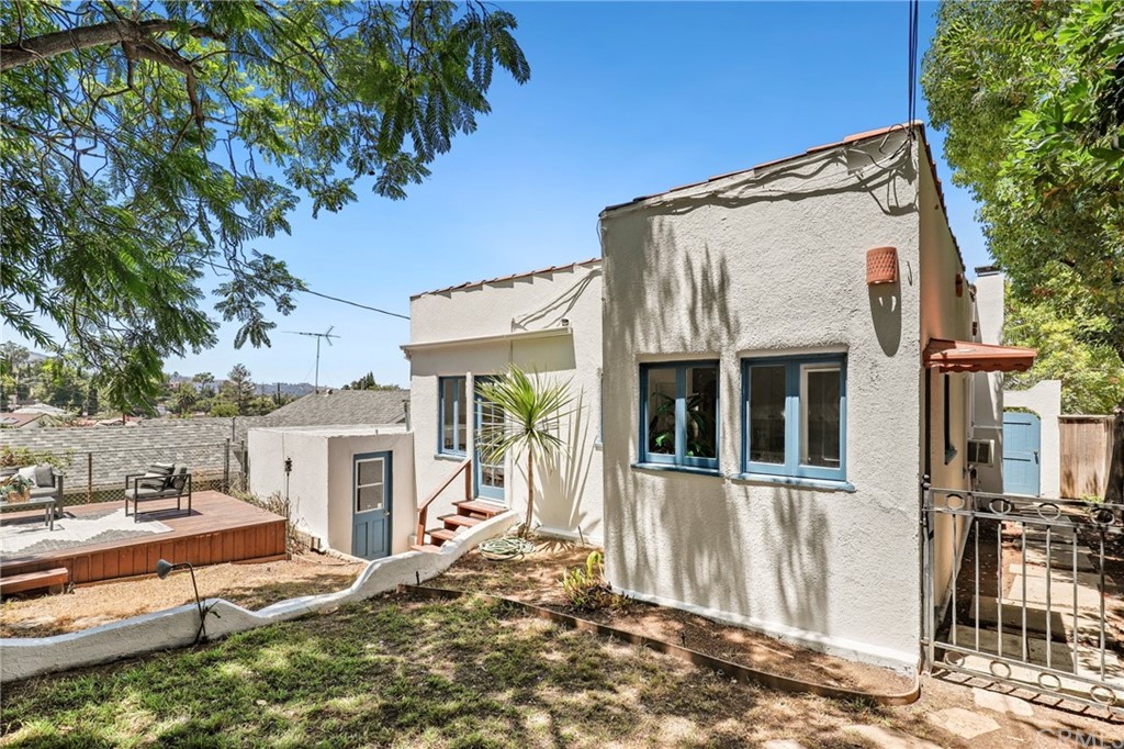 1126 Scofield Drive Glendale, CA 91205 - Photo 41 of 49 a view of a house with a tree and wooden fence