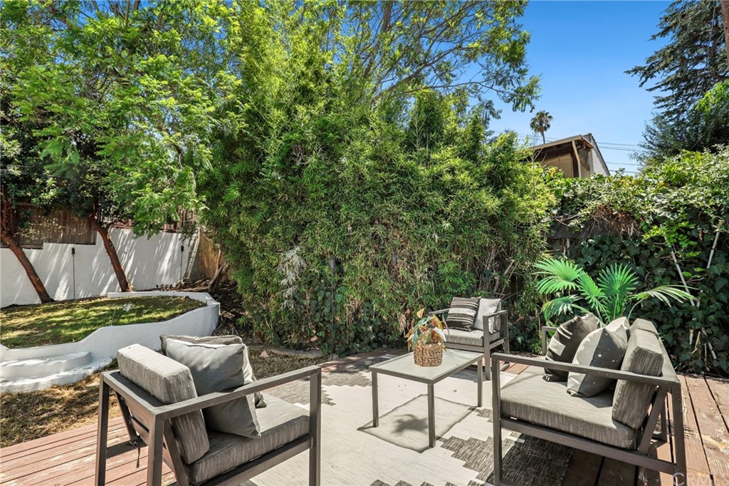 1126 Scofield Drive Glendale, CA 91205 - Photo 43 of 49 a backyard with table and chairs and potted plants