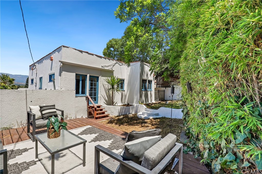 1126 Scofield Drive Glendale, CA 91205 - Photo 45 of 49 a view of a patio with couches table and chairs and potted plants