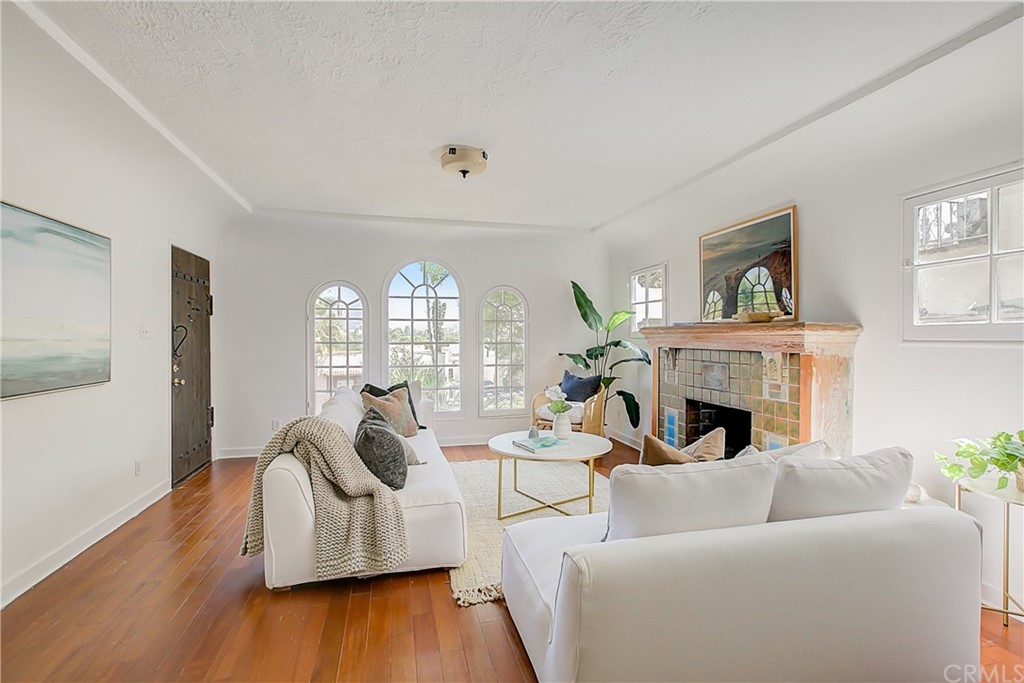 1126 Scofield Drive Glendale, CA 91205 - Photo 6 of 49 a living room with furniture fireplace and wooden floor