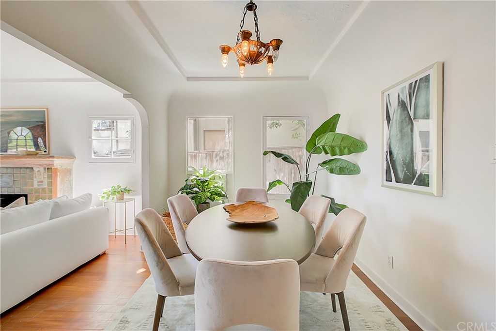 1126 Scofield Drive Glendale, CA 91205 - Photo 10 of 49 a dining room with furniture potted plants and wooden floor