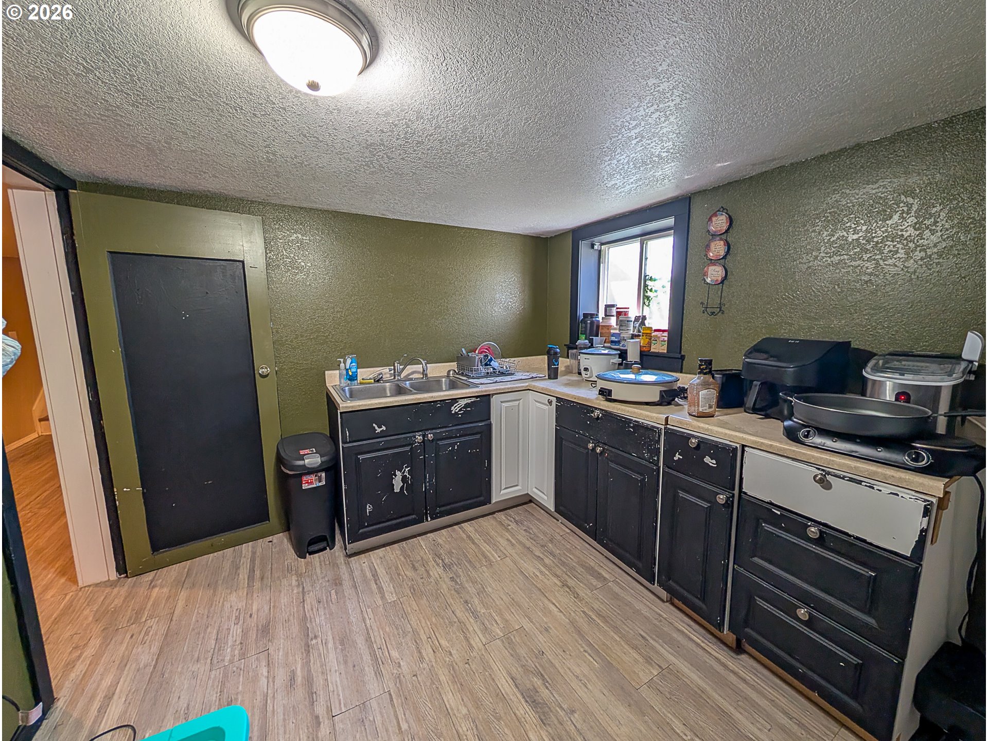 2802 North Spruce Street La Grande, OR 97850 - Photo 16 of 26 a kitchen with stainless steel appliances granite countertop a sink stove and refrigerator