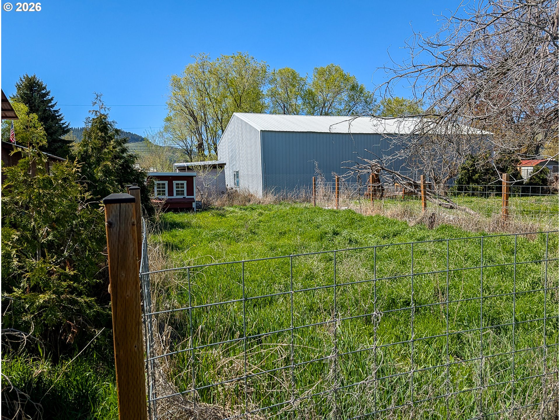 2802 North Spruce Street La Grande, OR 97850 - Photo 25 of 26 a view of a house with a yard and potted plants