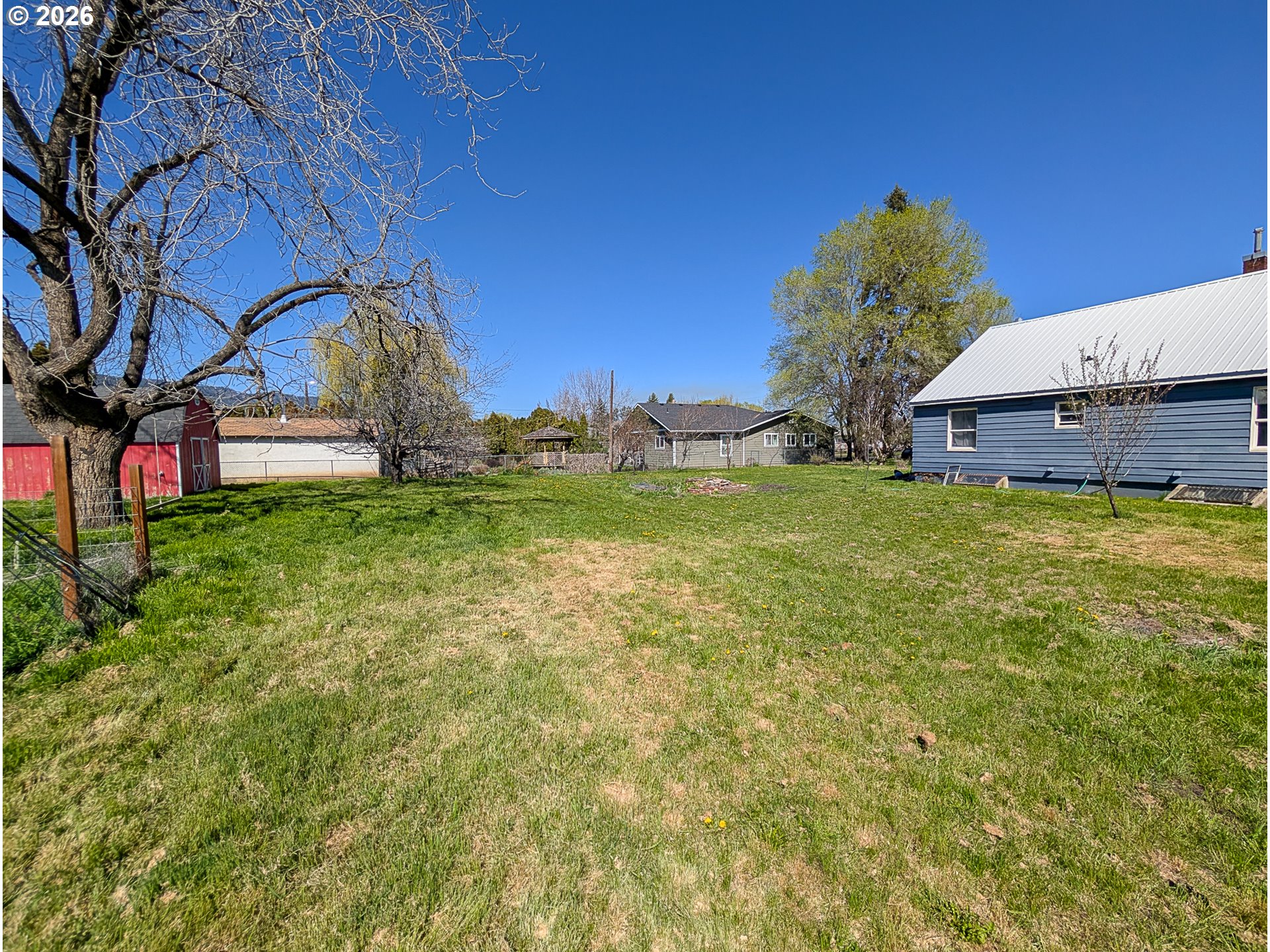 2802 North Spruce Street La Grande, OR 97850 - Photo 26 of 26 a backyard of a house with table and chairs