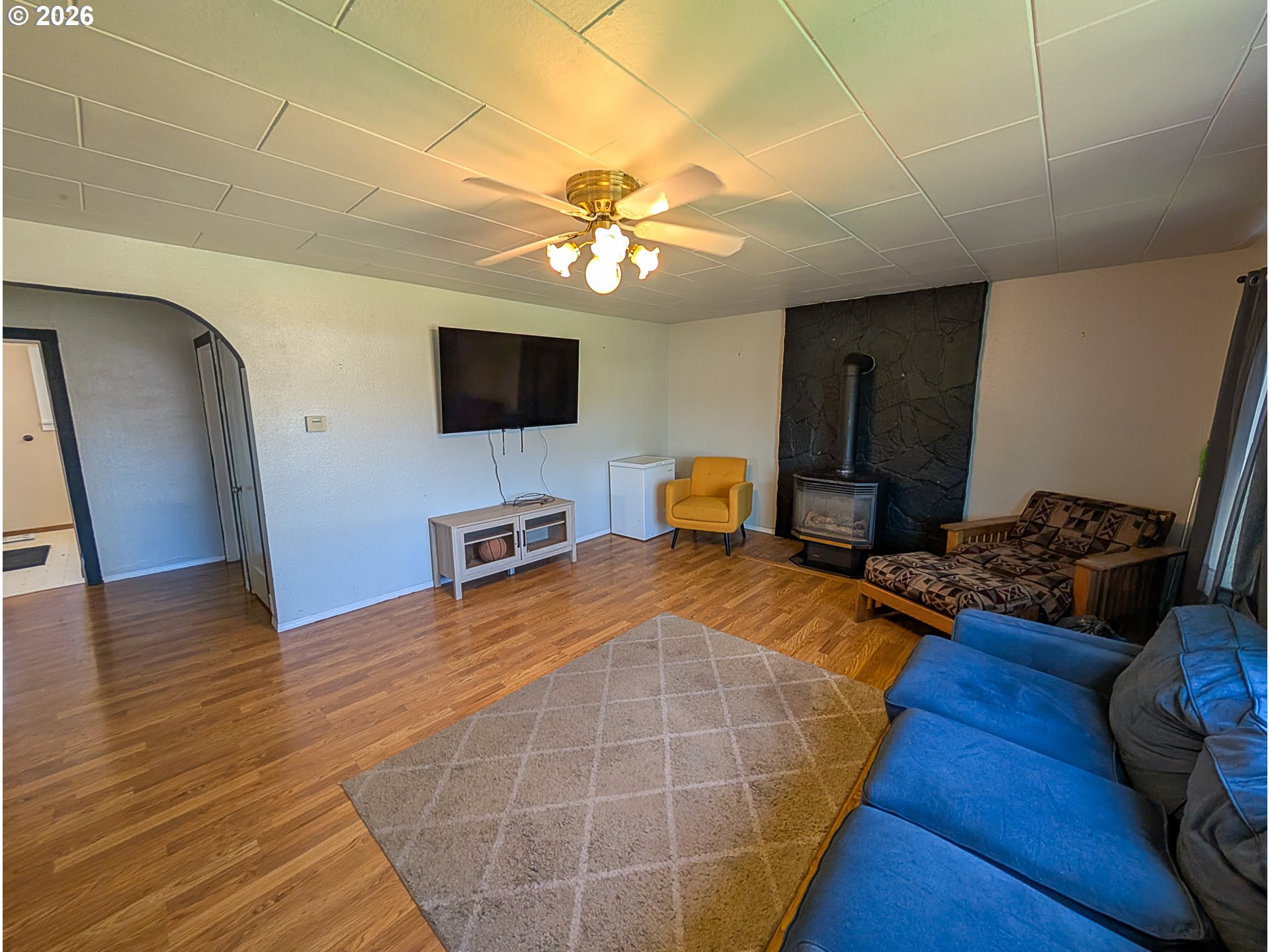 2802 North Spruce Street La Grande, OR 97850 - Photo 3 of 26 a living room with furniture and a flat screen tv