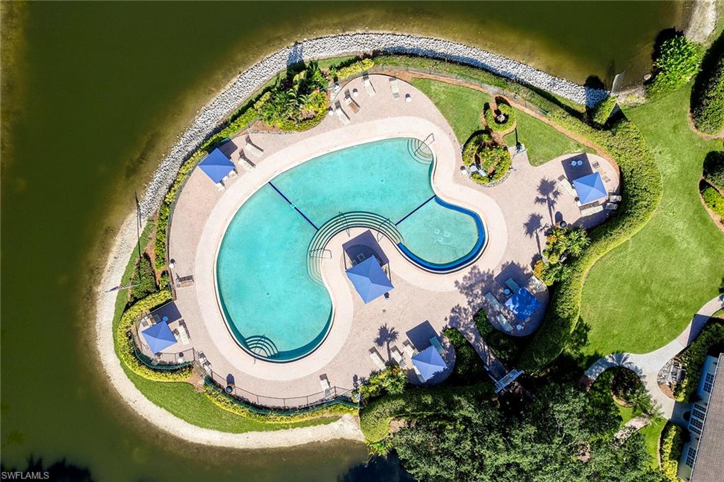 6533 Ilex Circle Naples, FL 34109 - Photo 13 of 34 an aerial view of a swimming pool a yard and a garden