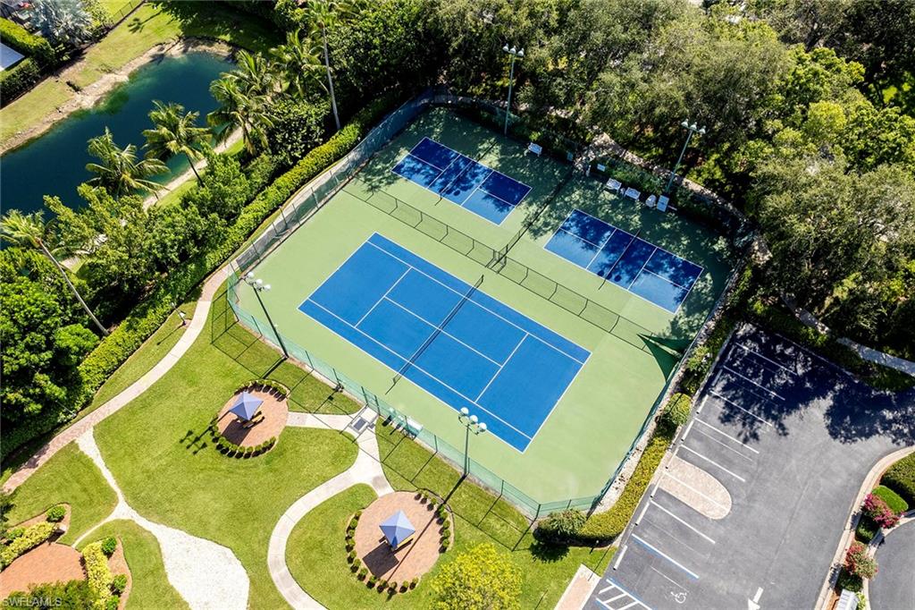 6533 Ilex Circle Naples, FL 34109 - Photo 14 of 34 an aerial view of a swimming pool with a yard