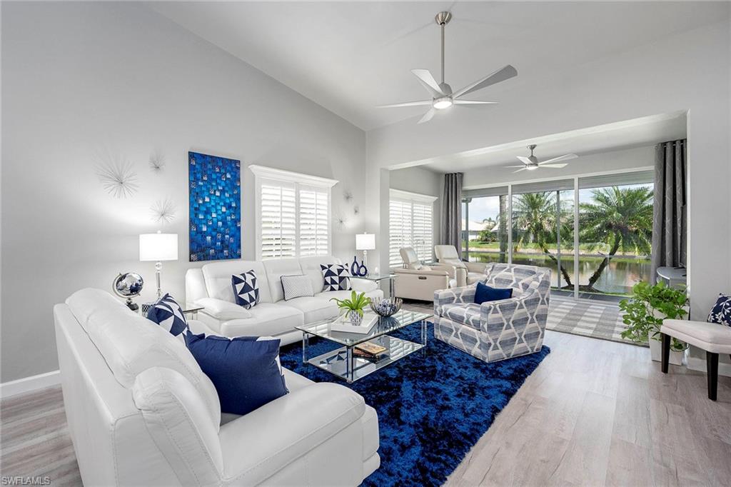 6533 Ilex Circle Naples, FL 34109 - Photo 24 of 34 a living room with furniture and a large window