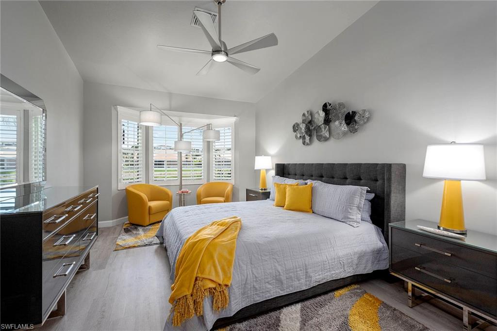 6533 Ilex Circle Naples, FL 34109 - Photo 28 of 34 a bedroom with bed and balcony