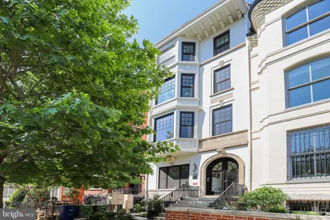 a front view of a multi story residential apartment building