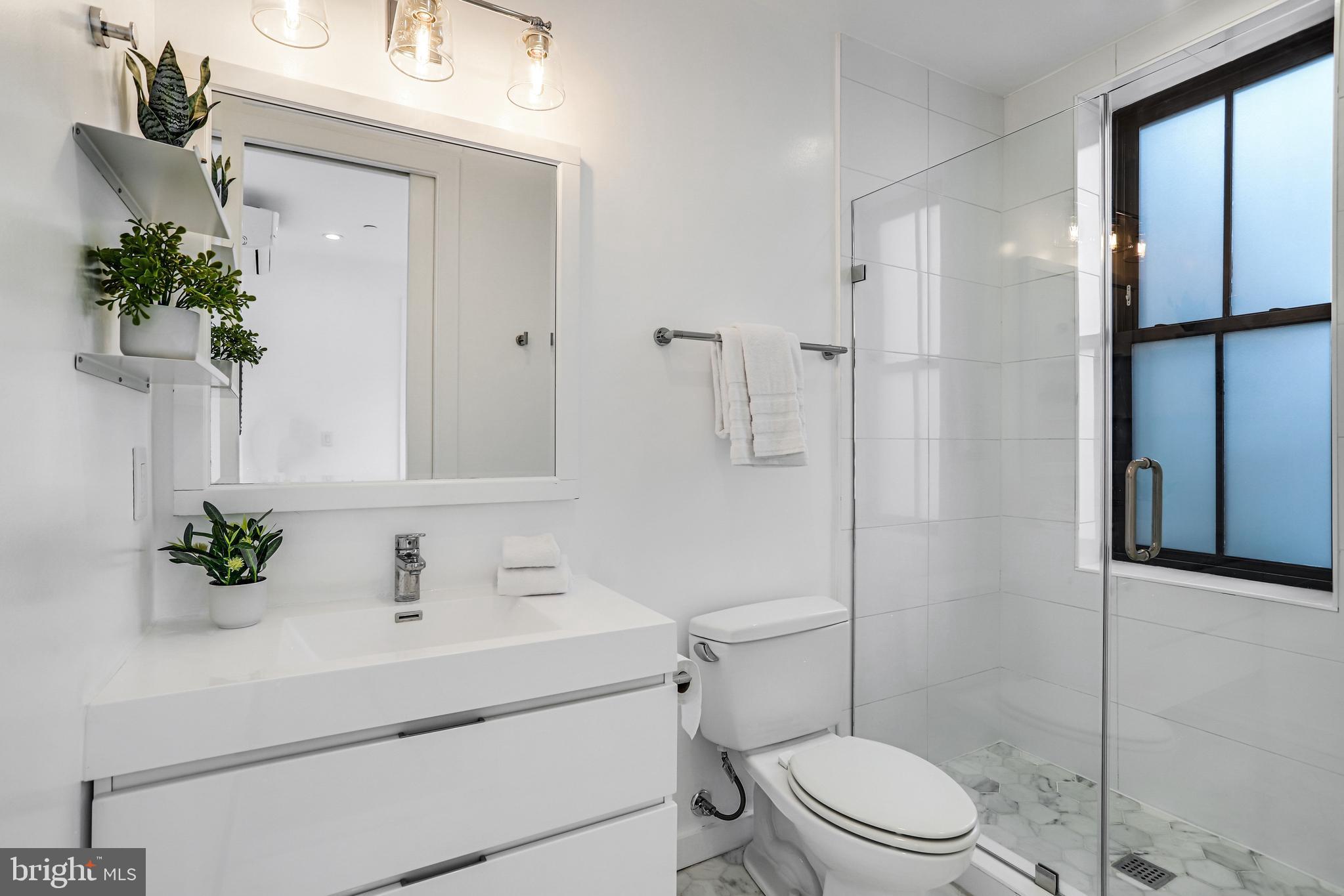 1412 15th Street Northwest, Unit 8 Washington, DC 20005 - Photo 15 of 15 a bathroom with a sink toilet and shower