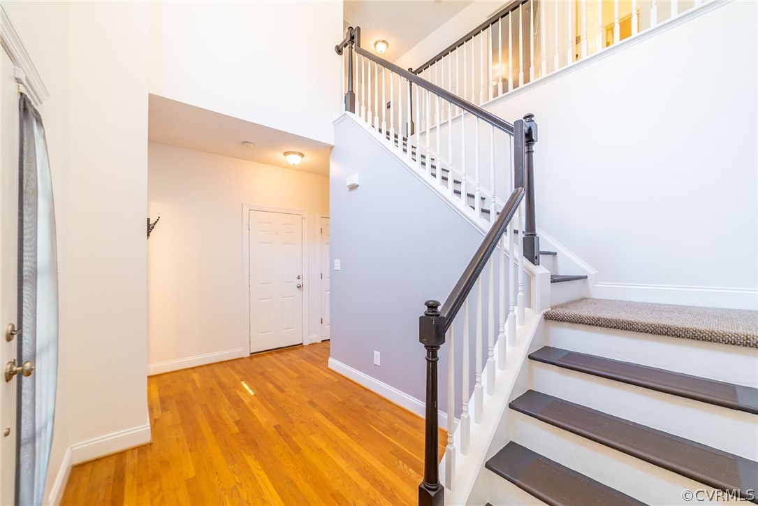 11870 Winterpock Road Chesterfield, VA 23838 - Photo 3 of 50 a view of staircase with wooden floor and white walls