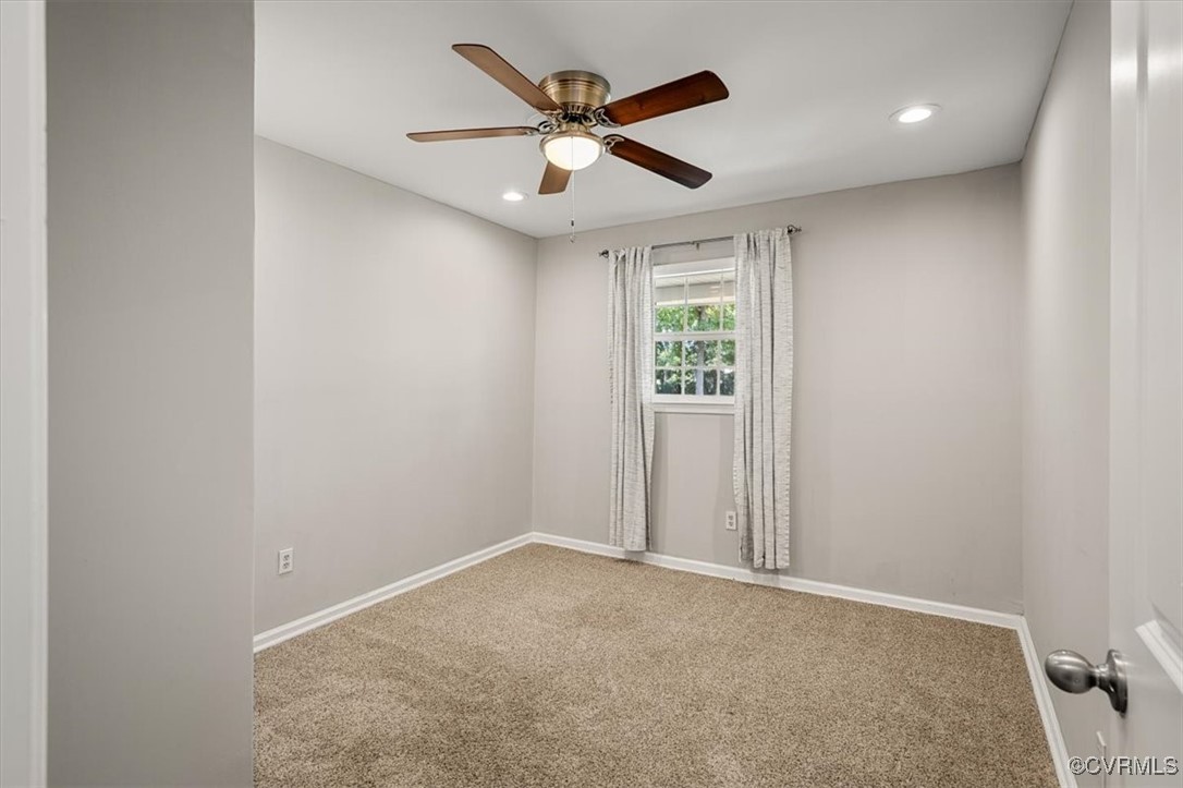 4600 Cool Hill Road Providence Forge, VA 23140 - Photo 16 of 23 an empty room with windows and ceiling fan