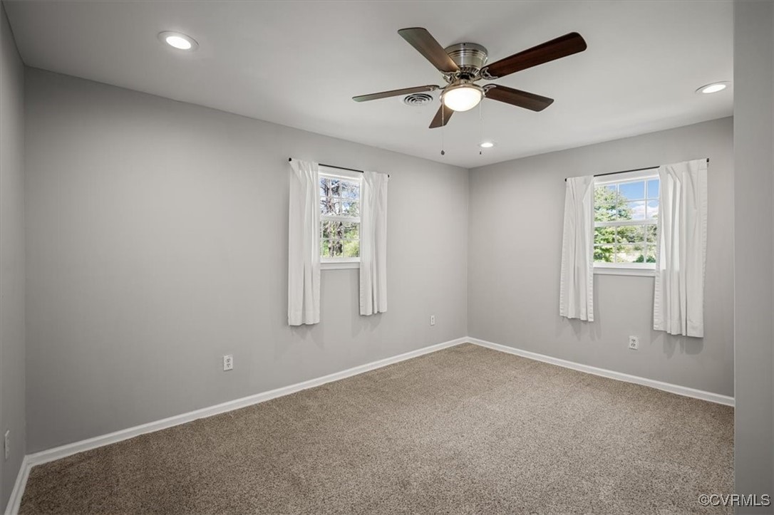 4600 Cool Hill Road Providence Forge, VA 23140 - Photo 17 of 23 an empty room with windows and fan