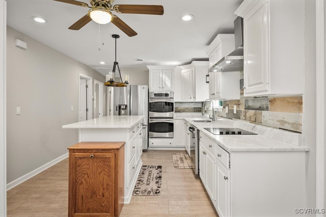 4600 Cool Hill Road Providence Forge, VA 23140 - Photo 7 of 23 a kitchen with a stove cabinets and a ceiling fan