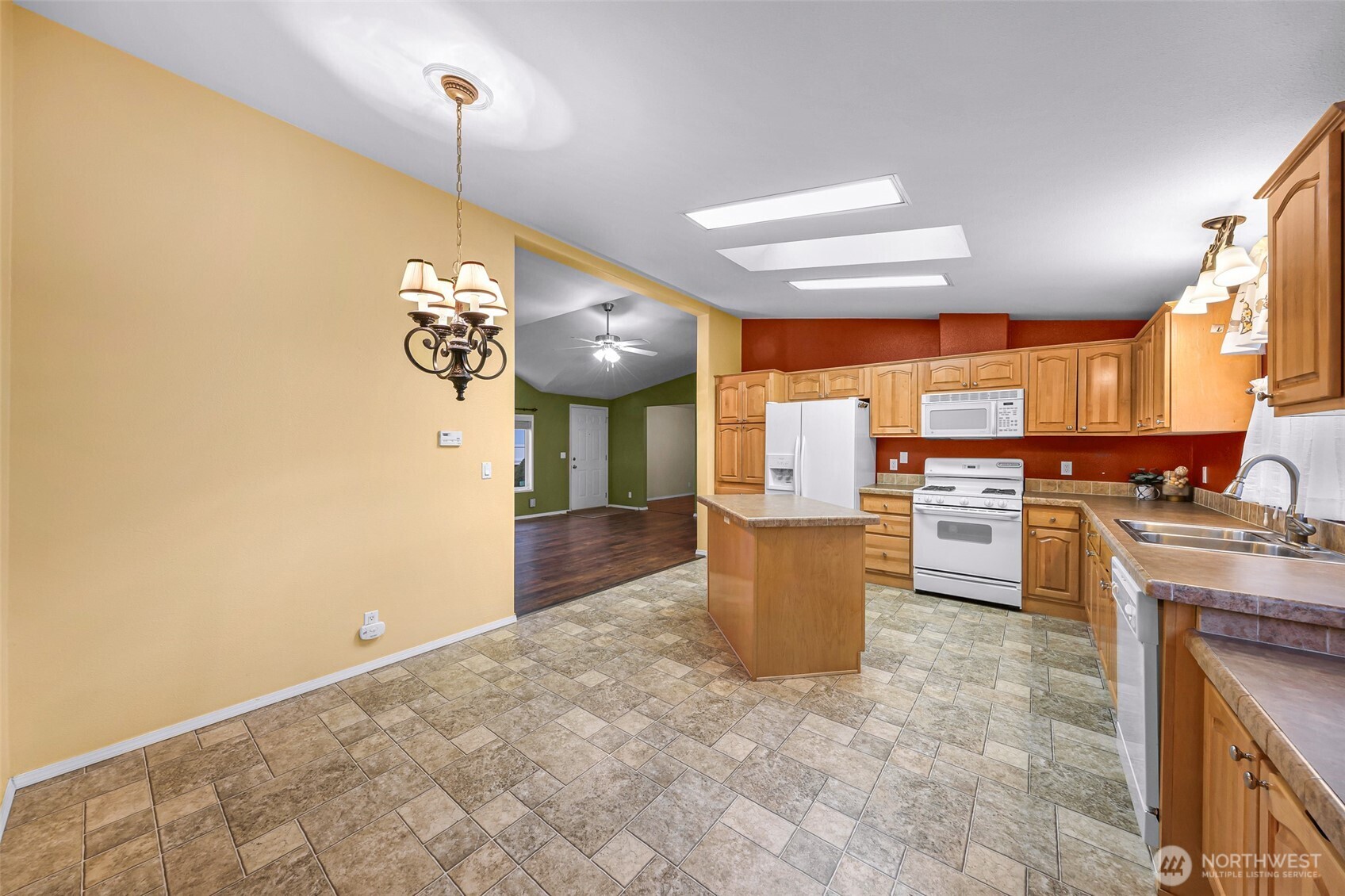 6350 Portal Way, Unit 48 Ferndale, WA 98248 - Photo 11 of 37 a kitchen with a refrigerator and a stove