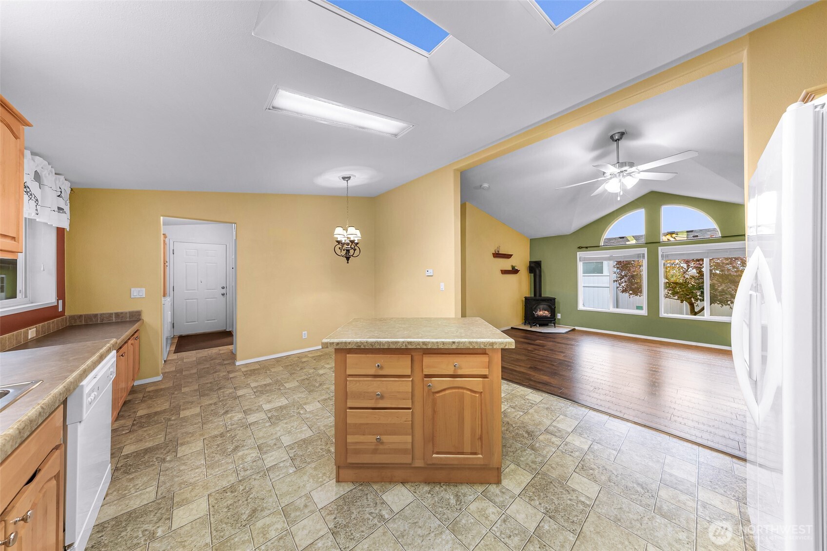 6350 Portal Way, Unit 48 Ferndale, WA 98248 - Photo 12 of 37 a view of a kitchen with a sink and a living room