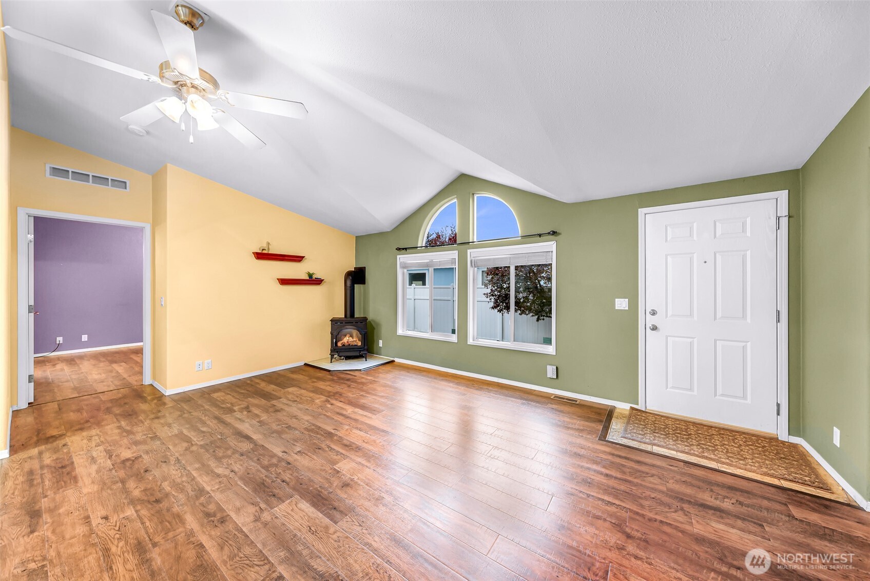 6350 Portal Way, Unit 48 Ferndale, WA 98248 - Photo 13 of 37 a view of an empty room with wooden floor and a window
