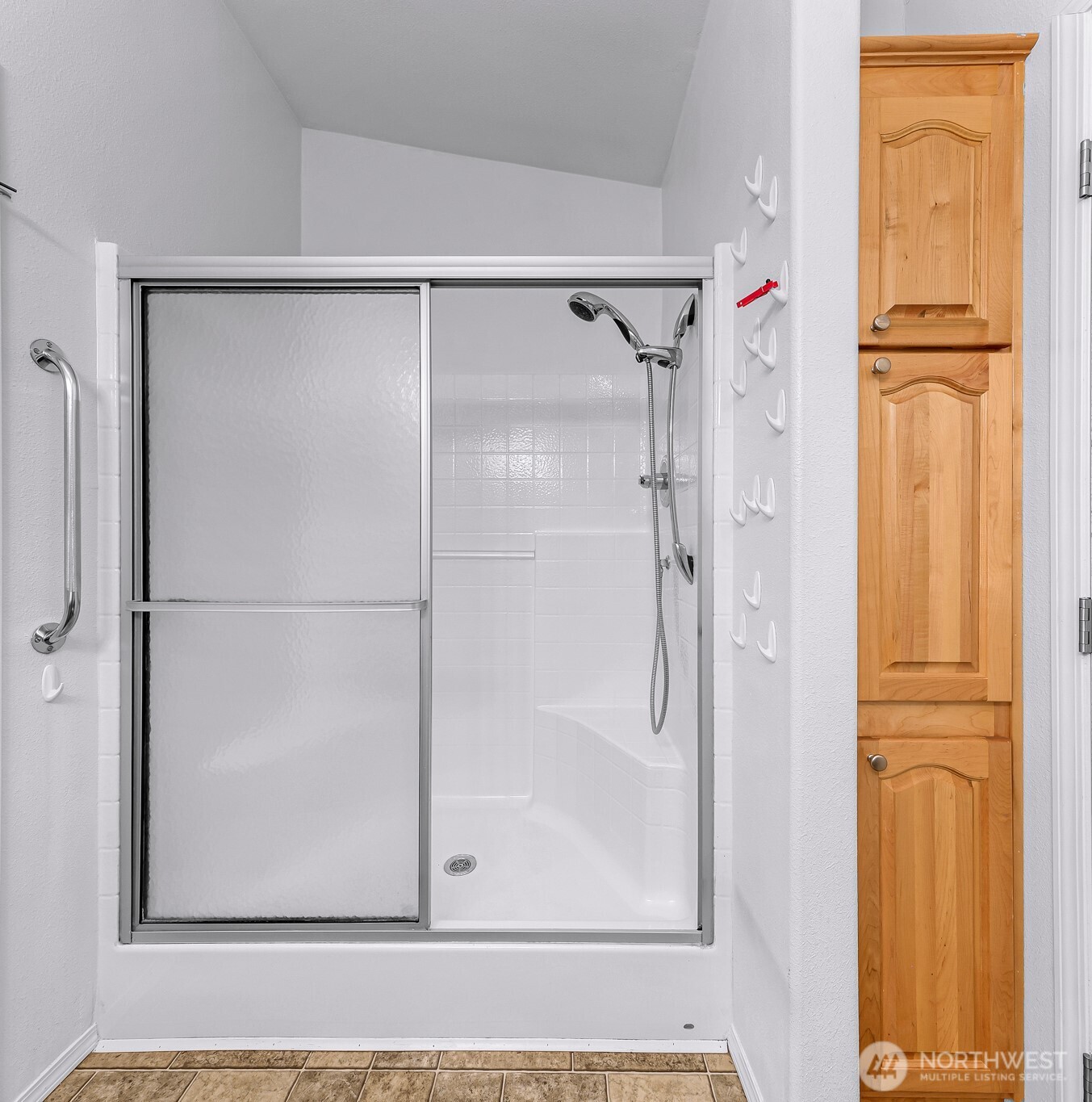 6350 Portal Way, Unit 48 Ferndale, WA 98248 - Photo 18 of 37 a bathroom with a glass shower door