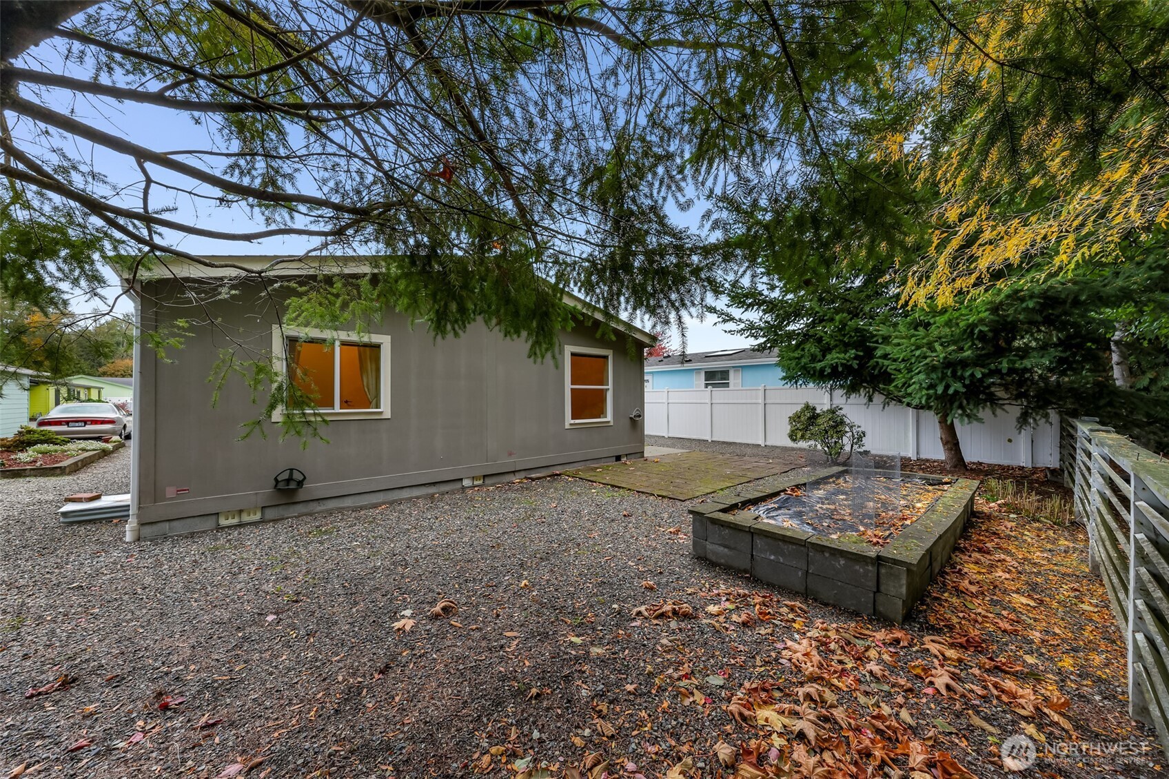 6350 Portal Way, Unit 48 Ferndale, WA 98248 - Photo 33 of 37 a backyard of a house with yard and outdoor seating