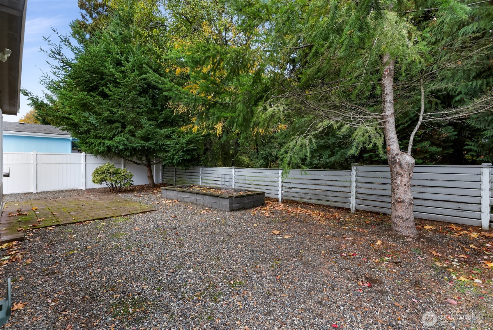 6350 Portal Way, Unit 48 Ferndale, WA 98248 - Photo 34 of 37 a view of a backyard with trees