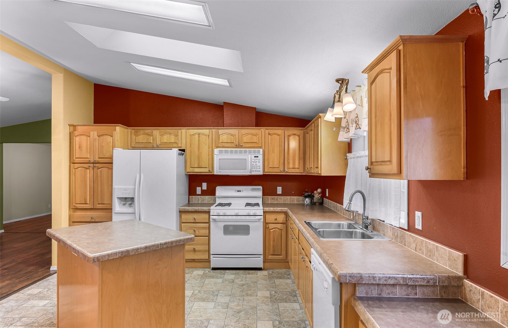6350 Portal Way, Unit 48 Ferndale, WA 98248 - Photo 7 of 37 a kitchen with a sink a stove and a refrigerator