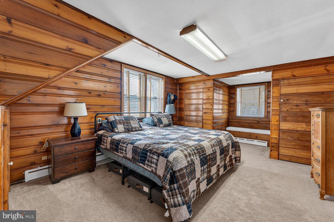 2062 Kinter Avenue Hamilton, NJ 08610 - Photo 14 of 19 a bed sitting in a room next to a window