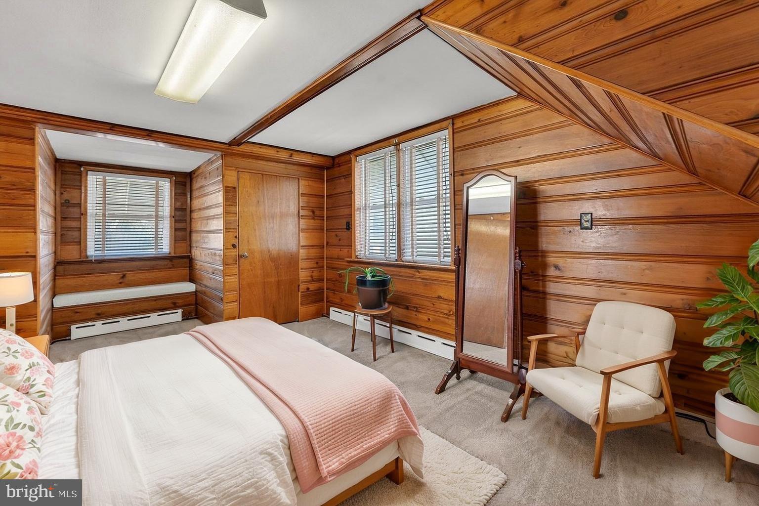 2062 Kinter Avenue Hamilton, NJ 08610 - Photo 15 of 19 a bedroom with a bed chair and a large window