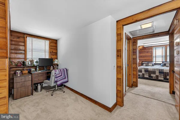 a workspace with furniture and window