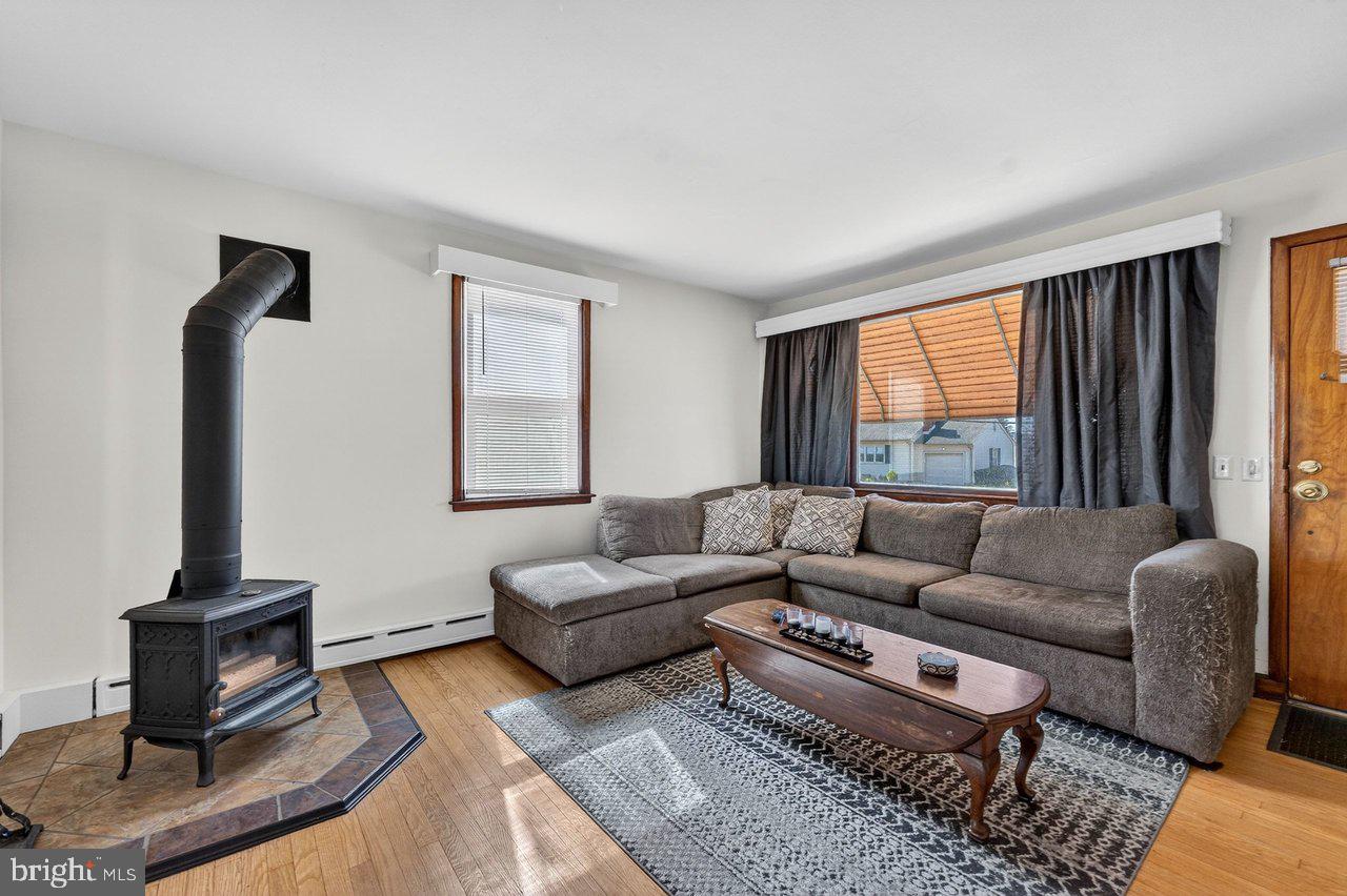 2062 Kinter Avenue Hamilton, NJ 08610 - Photo 3 of 19 a living room with furniture a rug and a window