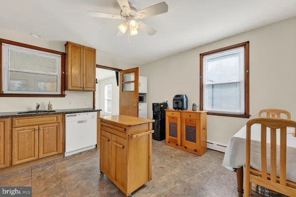 a kitchen with cabinets a sink and appliances