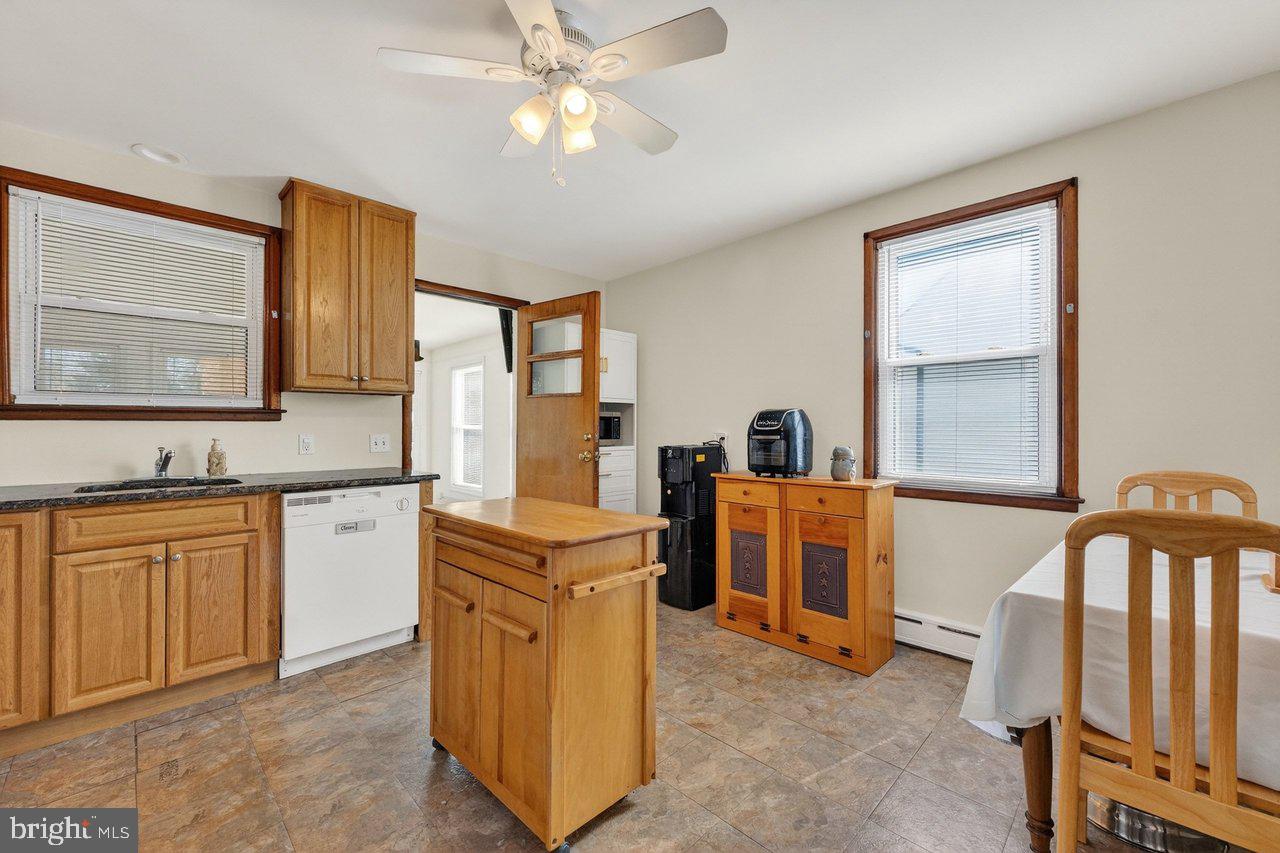2062 Kinter Avenue Hamilton, NJ 08610 - Photo 7 of 19 a kitchen with cabinets a sink and appliances