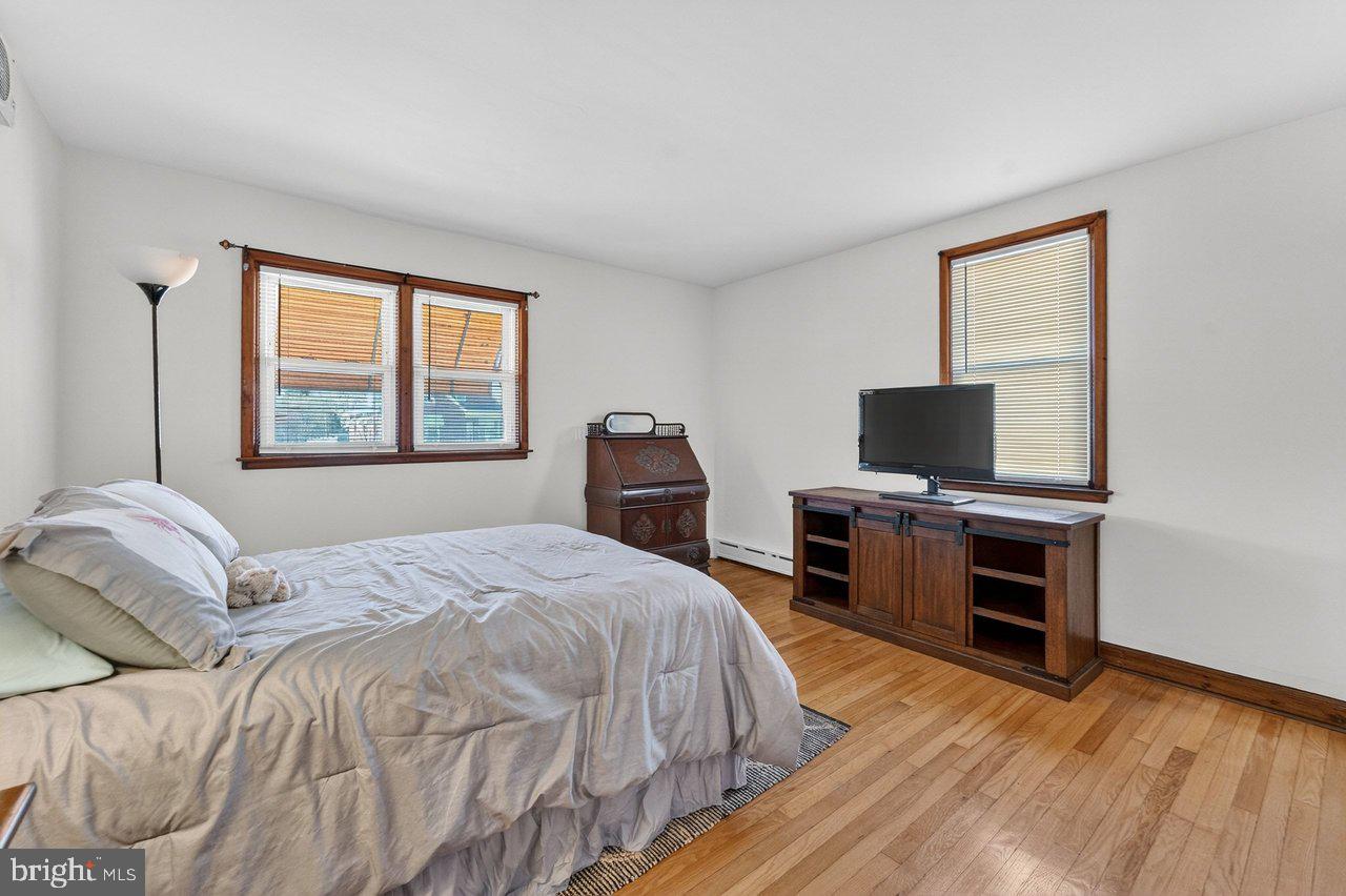 2062 Kinter Avenue Hamilton, NJ 08610 - Photo 10 of 19 a bedroom with a bed and a flat screen tv