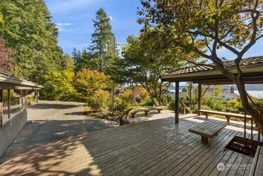 7150 Northeast North Shore Road Belfair, WA 98528 - Photo 11 of 32 a view of a patio with wooden floor