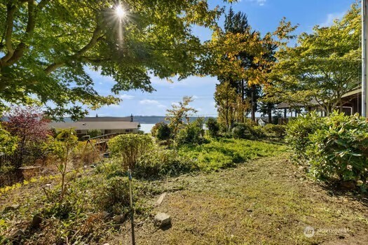 7150 Northeast North Shore Road Belfair, WA 98528 - Photo 12 of 32 a view of a lake with a tree