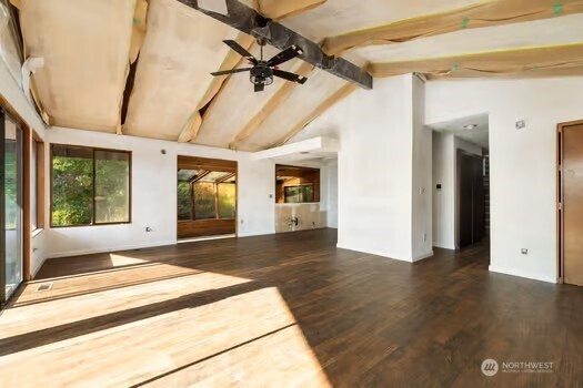 7150 Northeast North Shore Road Belfair, WA 98528 - Photo 15 of 32 a view of a room with wooden floor and windows