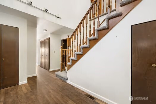 7150 Northeast North Shore Road Belfair, WA 98528 - Photo 19 of 32 a view of staircase with white walls and a window
