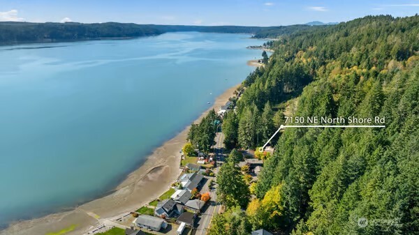 7150 Northeast North Shore Road Belfair, WA 98528 - Photo 2 of 32 a view of a lake from a balcony