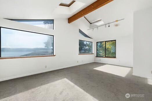 7150 Northeast North Shore Road Belfair, WA 98528 - Photo 21 of 32 an empty room with windows
