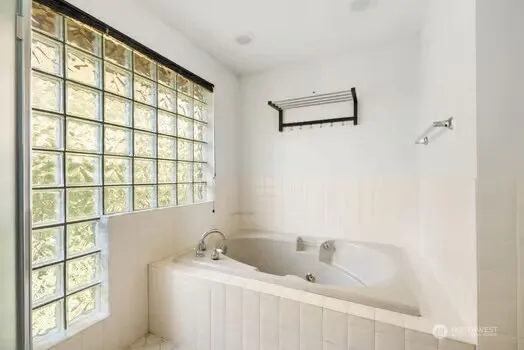 a view of an empty room with windows