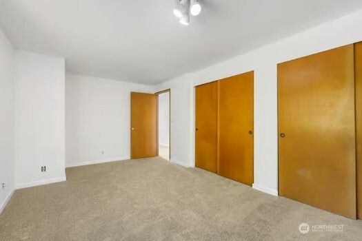 7150 Northeast North Shore Road Belfair, WA 98528 - Photo 26 of 32 a view of an empty room with windows