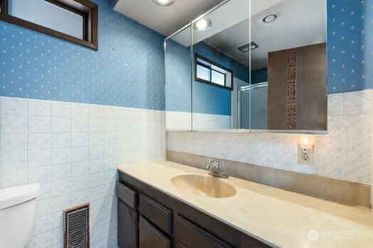 7150 Northeast North Shore Road Belfair, WA 98528 - Photo 29 of 32 a bathroom with a sink and a mirror