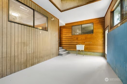 7150 Northeast North Shore Road Belfair, WA 98528 - Photo 30 of 32 a view of a back yard with wooden floor